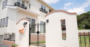 Painted block wall and wrought iron gate at an Arizona home
